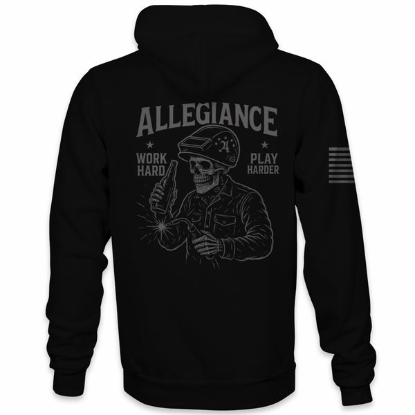 Back of Black Allegiance Play Harder Hoodie featuring large skeleton welder artwork with the phrase Work Hard Play Harder and a monochrome American flag on the sleeve.